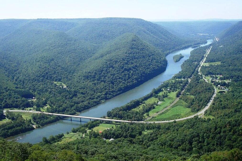 View of the West Branch Susquehanna River valley, with Pennsylvania State Route 120 (the Bucktail Trail) crossing it, looking west-northwest from Hyner View State Park