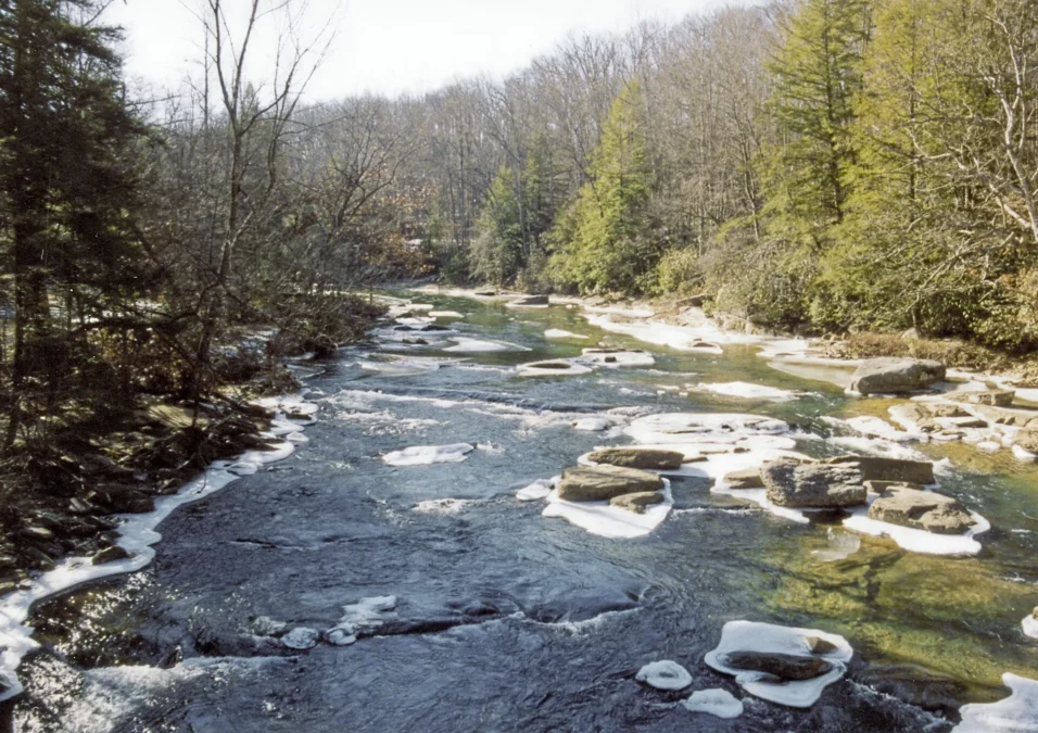 Audra State Park 1 Middle Fork River flowing over flat sandstone ledges with ice along the banks, Audra State Park, West Virginia