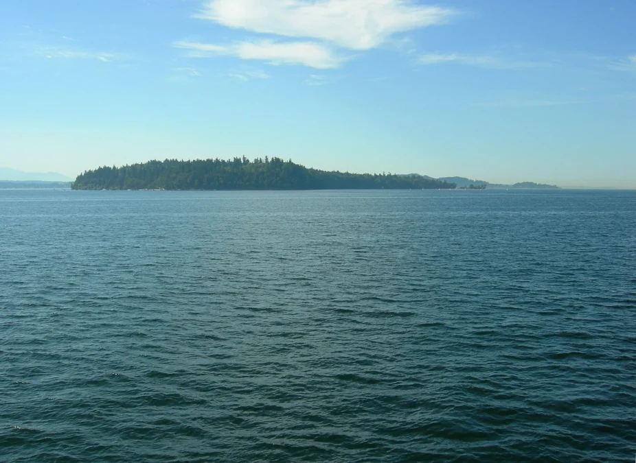 Forested Blake Island across the calm waters of Puget Sound, Blake Island Marine State Park, Washington