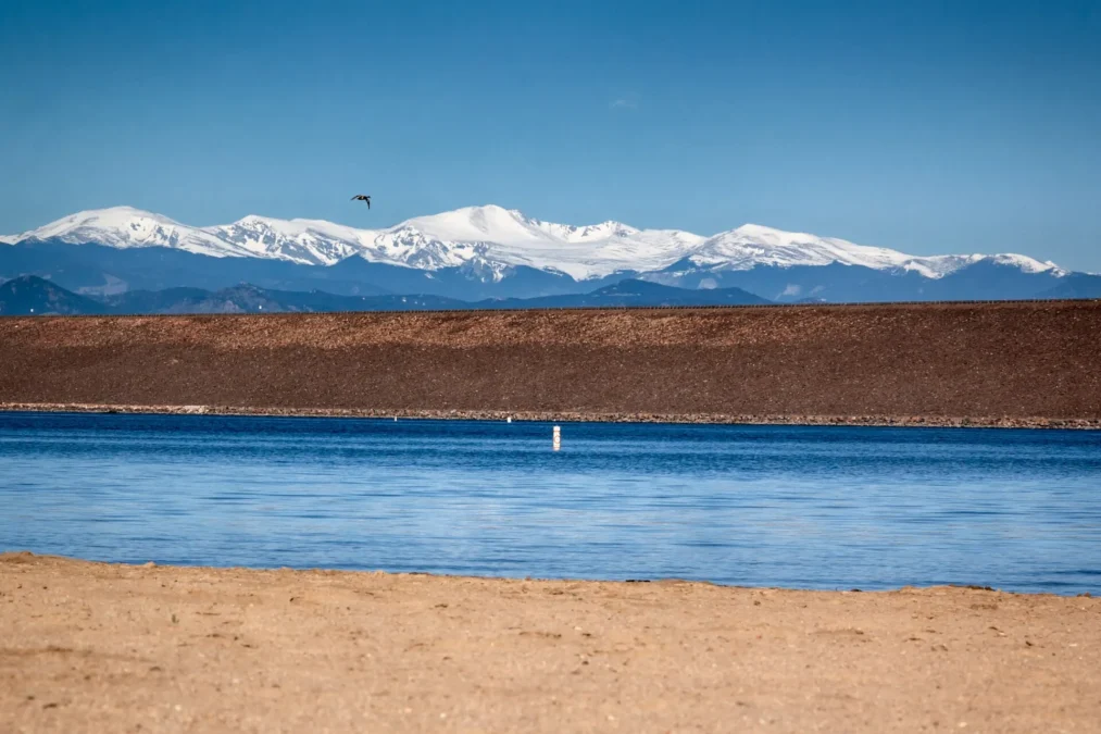 Cherry Creek State Park 3 Cherry Creek Reservoir and its earthen dam with snowcapped mountains beyond, Cherry Creek State Park, Colorado