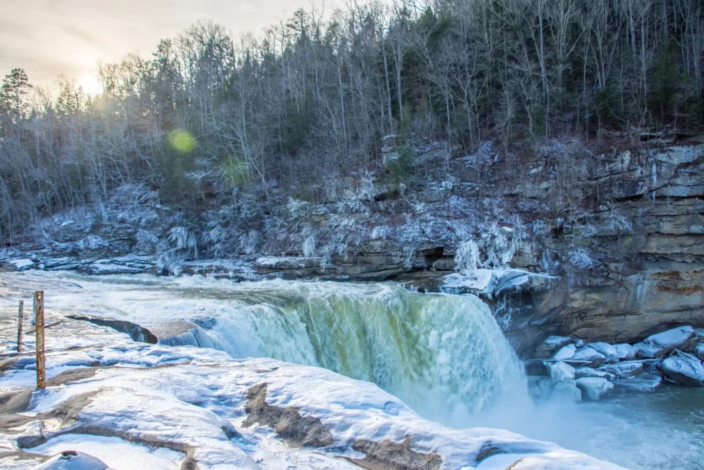 Cumberland Falls pouring over a broad ledge with frost on the rocks, Cumberland Falls State Resort Park, Kentucky