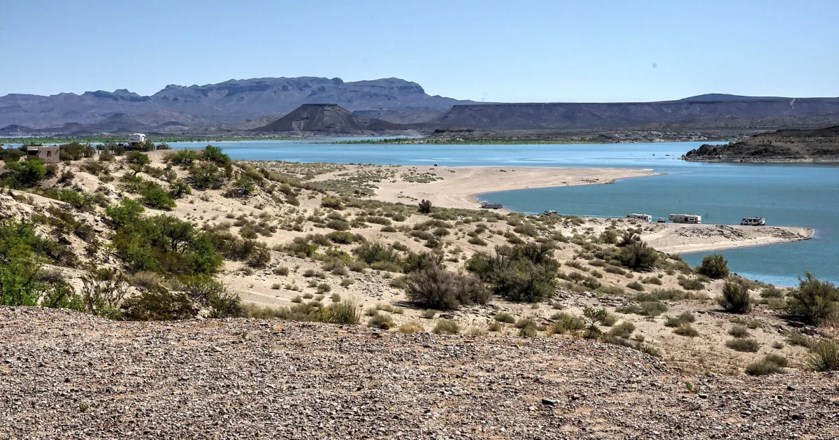 Elephant Butte Reservoir and sandy shoreline below desert mesas, Elephant Butte Lake State Park, New Mexico