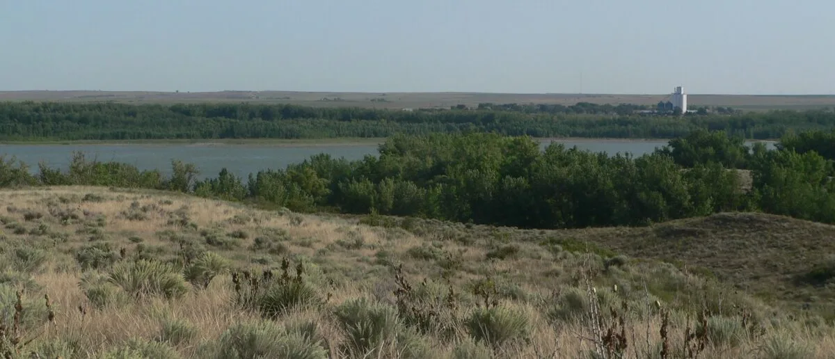 Enders Reservoir in southwestern Nebraska, viewed from the south with the town of Enders' grain elevator on the horizon