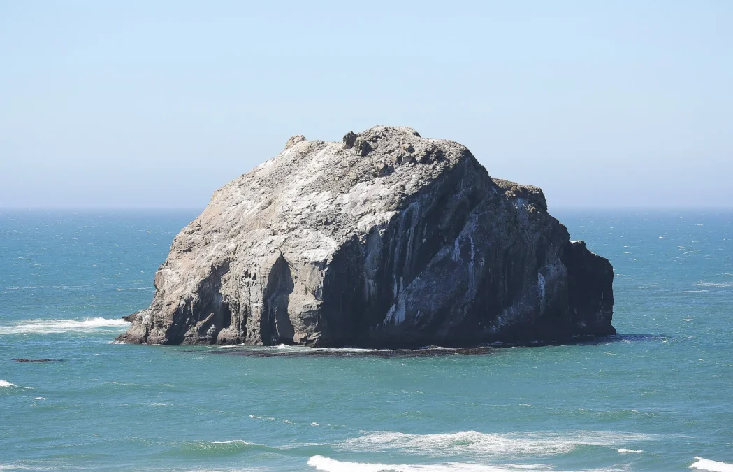 Face Rock sea stack off the beach at Face Rock State Scenic Viewpoint in Bandon, Oregon