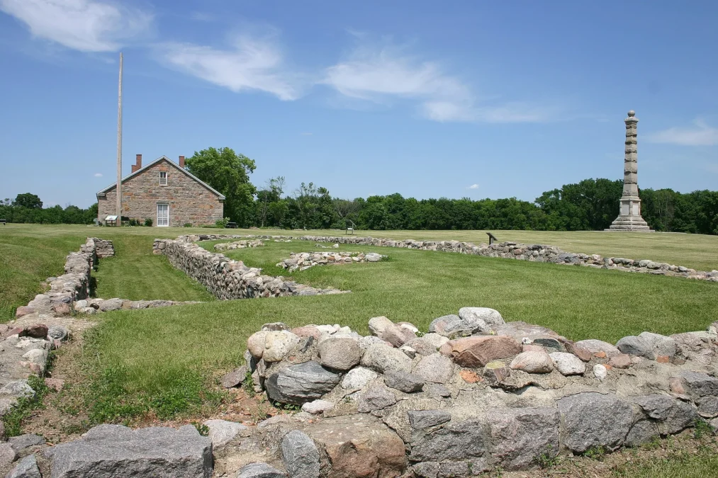 Stone foundations of the old fort with a restored building and monument, Fort Ridgely State Park, Minnesota