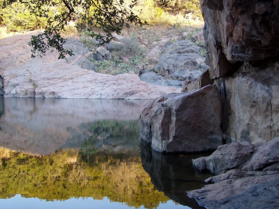 Inks Lake State Park 48 Pink granite boulders reflected in still water at Inks Lake State Park, Texas