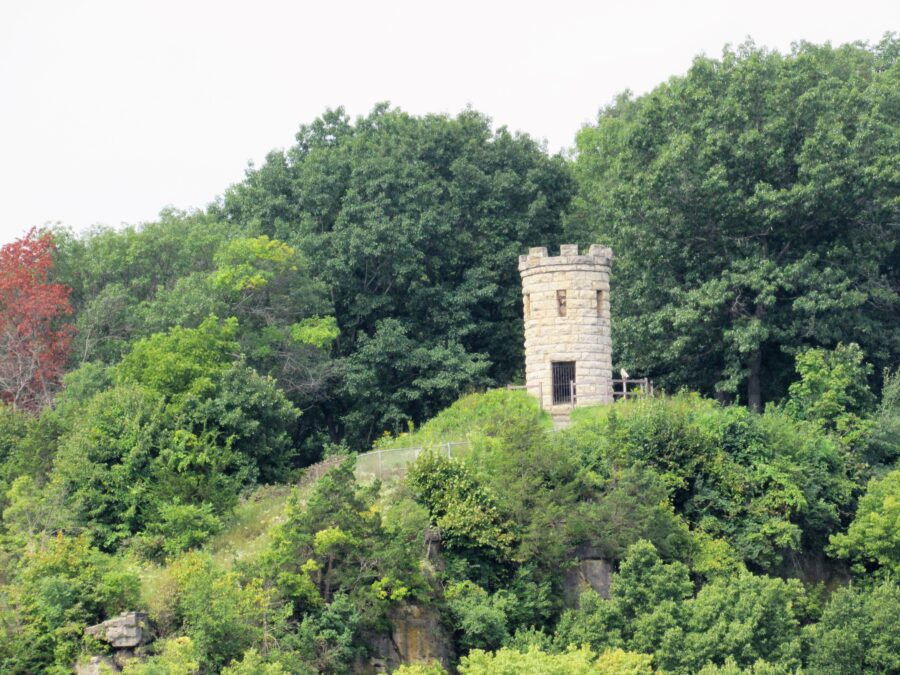 The Julien Dubuque Monument, a stone tower on a wooded bluff above the Mississippi River in the Mines of Spain State Recreation Area, Iowa