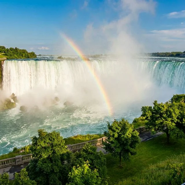 Niagara Falls illuminated at night with colorful lights