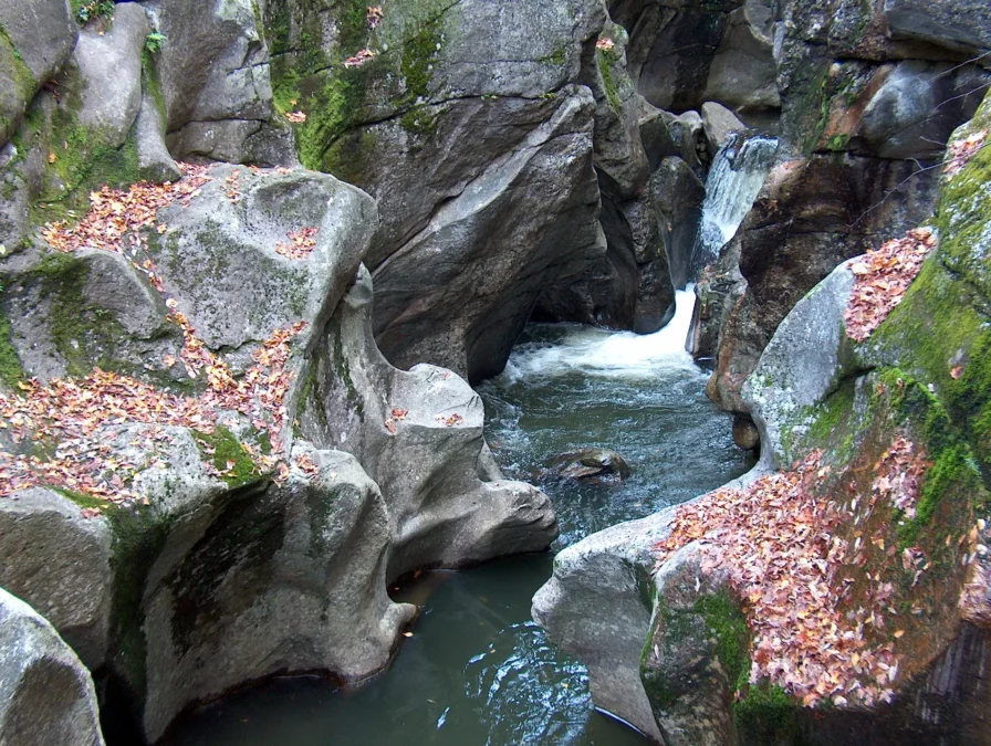 Water-carved granite of the Cockermouth River gorge at Sculptured Rocks Natural Area, New Hampshire